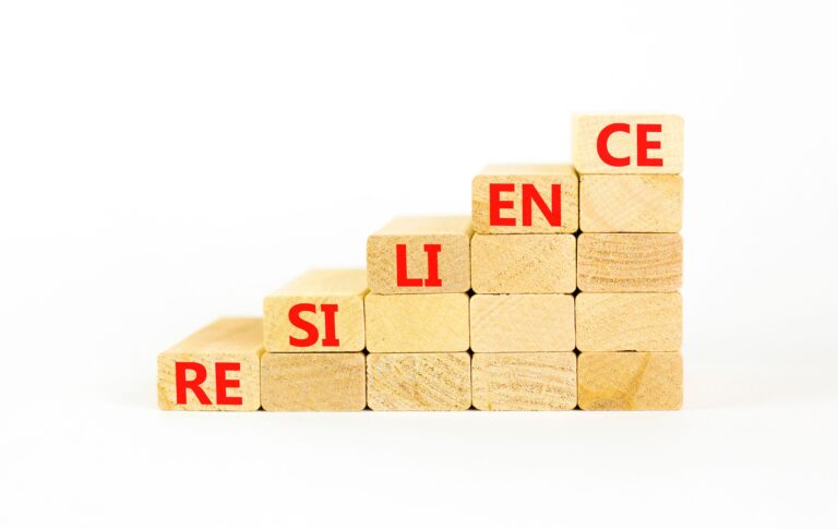 Building blocks forming stairs going upward say, “resilience.”